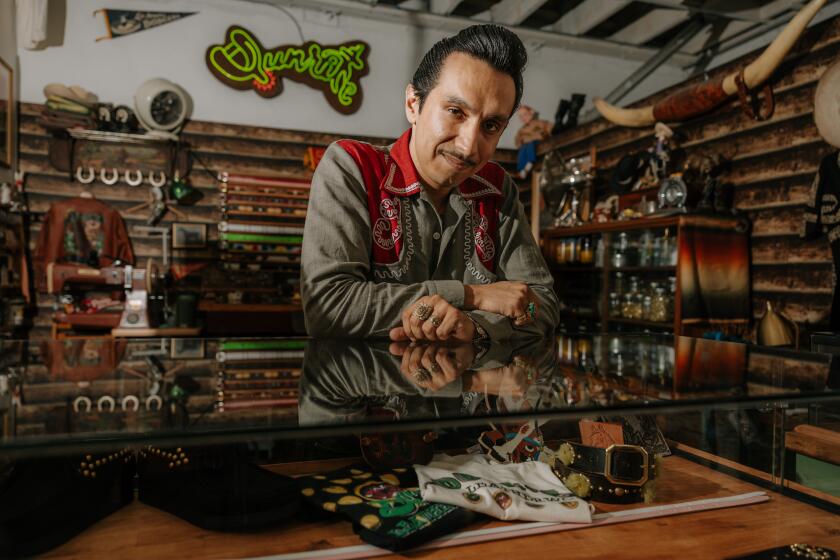 Los Angeles, CA - July 28: Guillermo Cuevas, owner of Dunrite Leatherworks, in his studio and showroom in Little Tokyo on Sunday, July 28, 2024 in Los Angeles, CA. (Jason Armond / Los Angeles Times)