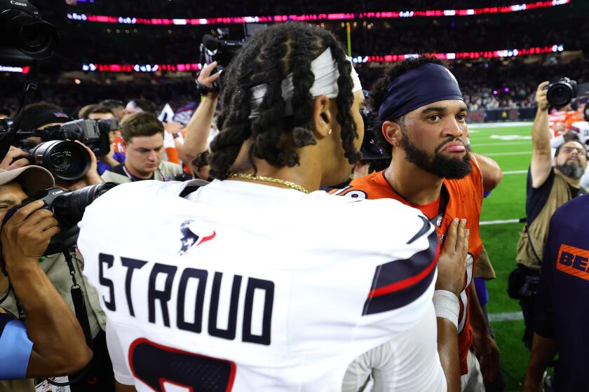 HOUSTON, TEXAS - SEPTEMBER 15: C.J. Stroud #7 of the Houston Texans shakes hands with Caleb Williams #18 of the Chicago Bears following the game at NRG Stadium on September 15, 2024 in Houston, Texas. (Photo by Alex Slitz/Getty Images)