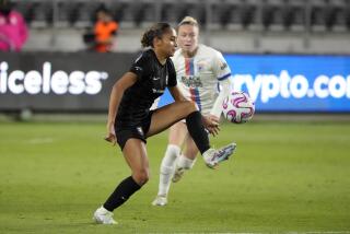 Angel City's Alyssa Thompson controls the ball against OL Reign.