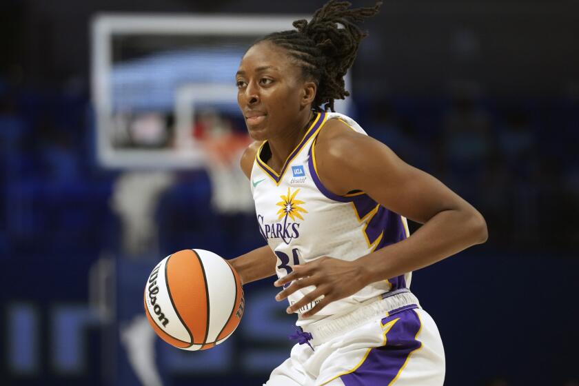 Los Angeles Sparks forward Nneka Ogwumike dribbles during the second half of a WNBA basketball game.