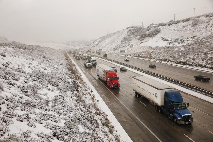 GORMAN, CA - NOVEMBER 27, 2019 Traffic continued to roll on the Interstate 5 Freeway Wednesday morning at the top of the 4,160 elevation Tejon Pass between Gorman and Frazier Park linking Southern California to the Central Valley as a storm out of the Gulf of Alaskas slid into the Southland today unleashing rain, snow, and cold winds through Thanksgiving. (Al Seib / Los Angeles Times)