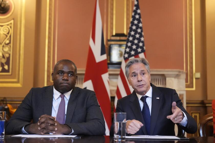 Secretary of State Antony Blinken, right, gestures as he participates with Britain's Foreign Secretary David Lammy, in a strategic dialogue meeting at the Foreign, Commonwealth and Development Office (FCDO) in London, Tuesday, Sept. 10, 2024. (AP Photo/Mark Schiefelbein, Pool)