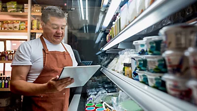 A man checking in a store