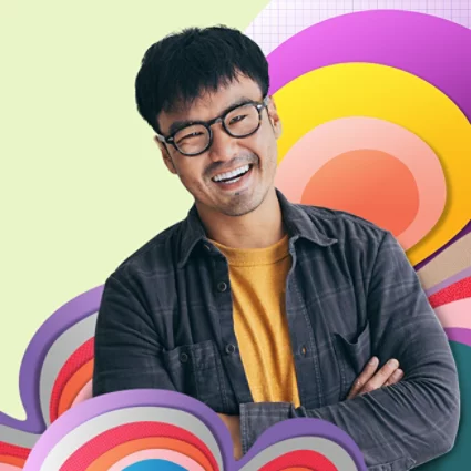 A smiling man with his arms crossed against a colorfully illustrated background.