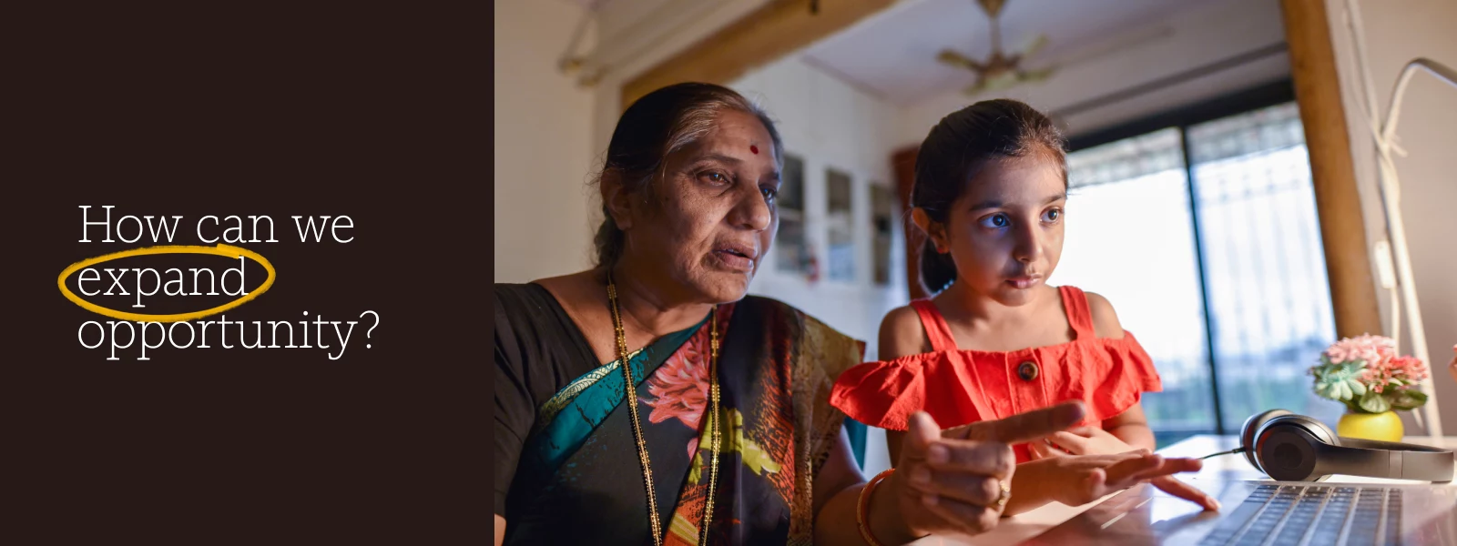 An older woman and her grandchild using a laptop together beside the words “How can we expand opportunity?”