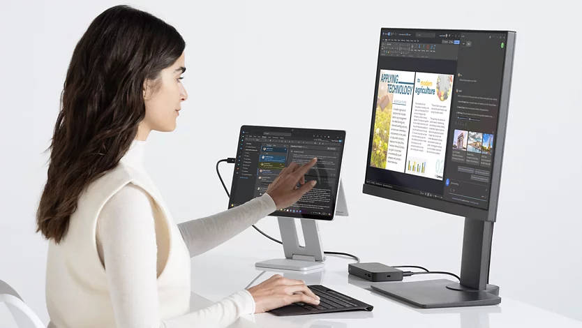 A person uses the touchscreen of a Surface Pro for Business while typing on a detached Surface Pro Flex Keyboard for Business.