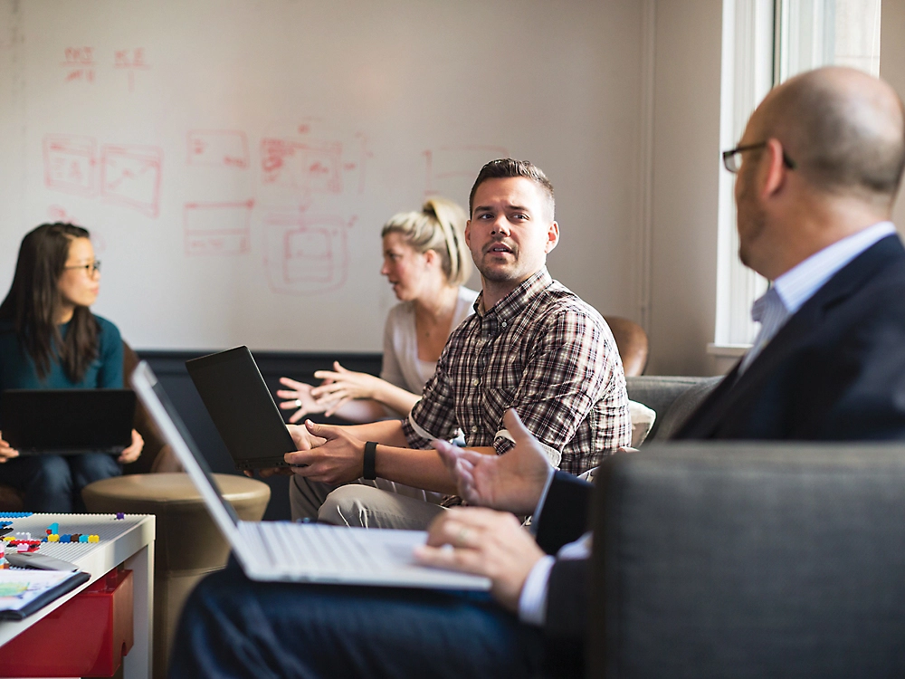 A group of people sitting in a room