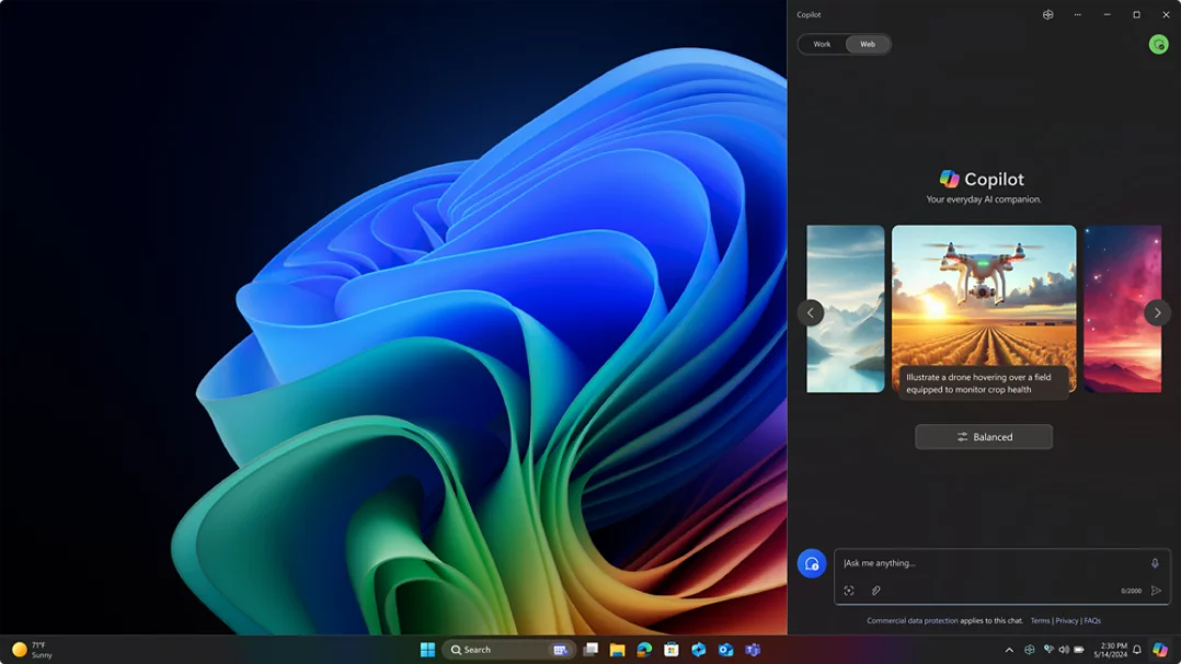 Schermata con il fiore simbolo di Windows 11 Pro e riquadro di Copilot che compare a destra.