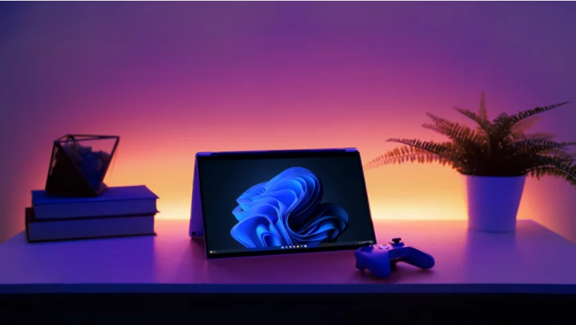 A Surface device on a table with a gaming controller