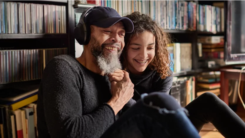 Father and daughter laugh together