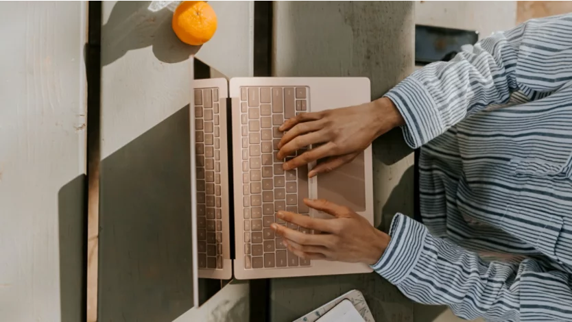 Person working on a Windows laptop