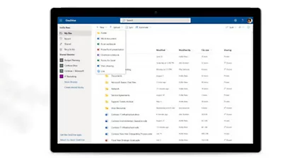 A plant, a few paperclips, and a tablet device showing a OneDrive account.