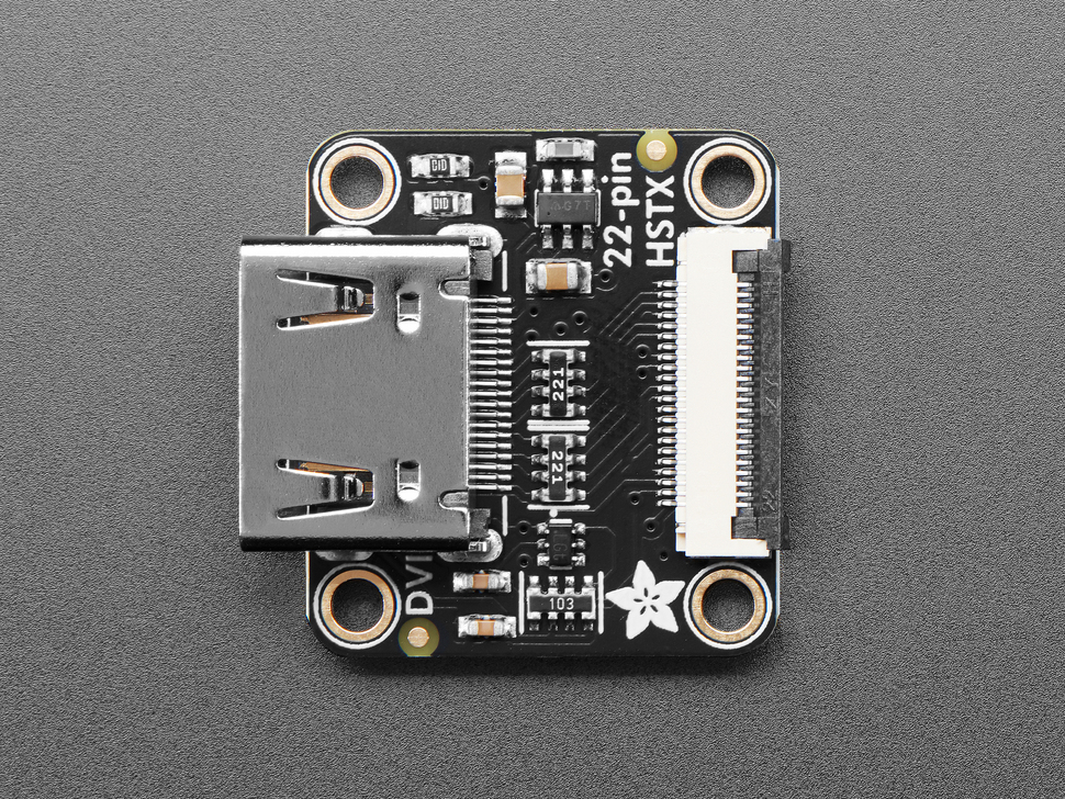 Overhead shot of black, square-shaped breakout board with DVI and 22-pin FPC connectors.