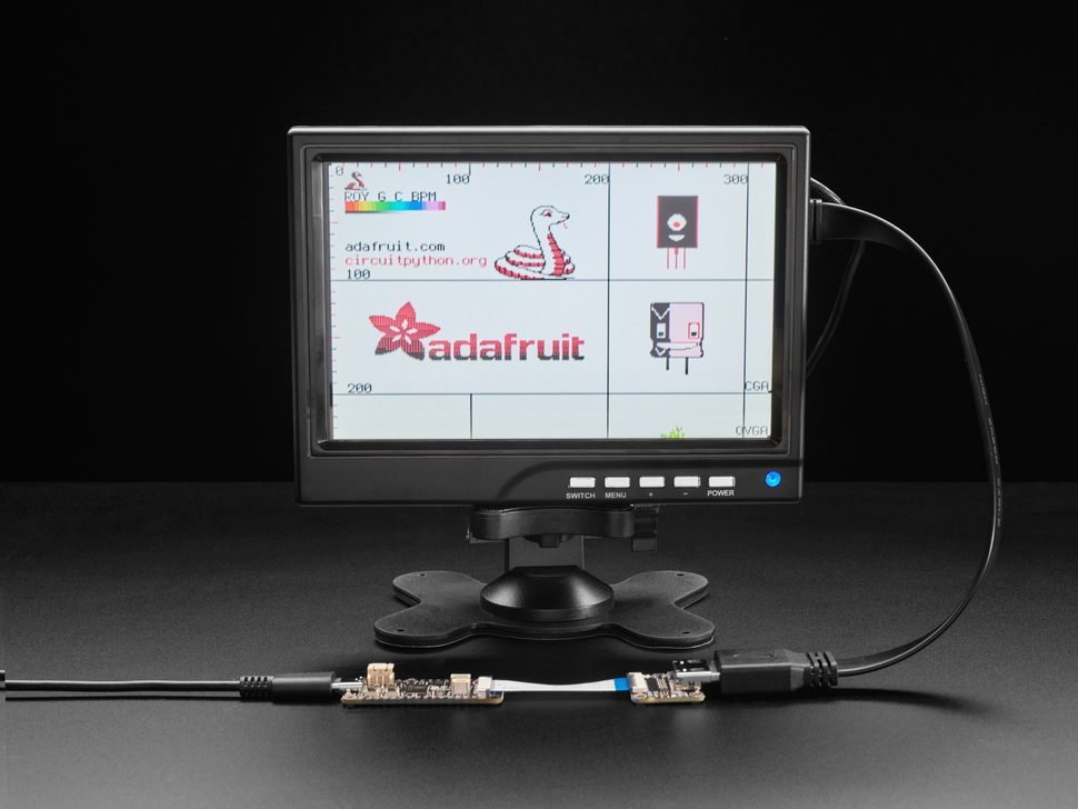 Lifestyle image of monitor hooked up to microcontroller and breakout. 