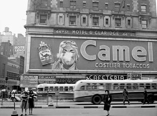 Camel cigarette sign with a man blowing smoke rings, Times Square, New York City, New York, 1943.