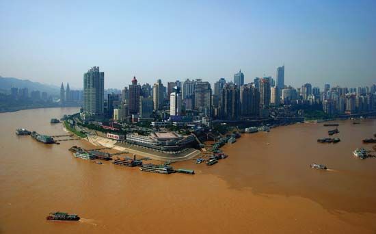 Skyline of the Chongtianmen area, at the confluence of the Yangtze (left) and Jialing (right) rivers, Chongqing, China.