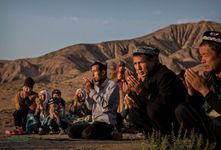 Uyghur family praying