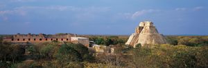 The ruined Nunnery Quadrangle (left) and the Pyramid of the Magician (right), Uxmal, Yucatán, Mexico.