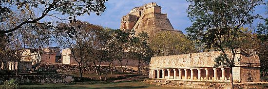 Pyramid of the Magician (background) and the tlachtli ball court, Uxmal, Yucatán, Mexico.