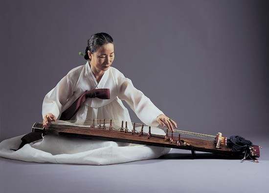 Musician playing a kayagŭm, a 12-stringed zither that is considered the Korean national instrument.