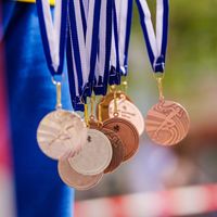 Gold, silver, and bronze medals in the air. Background for Rio Olympic time (Olympics, Olympic games)