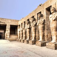 Temple ruins of columns and statures at Karnak, Egypt (Egyptian architecture; Egyptian archaelogy; Egyptian history)