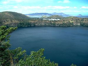 Asososca Lagoon, Lake Nicaragua, with oil refinery in the background, Nicaragua