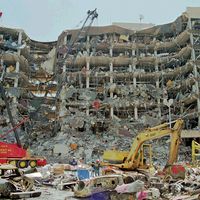 Heavy equipment is used to remove debris from the front of the Alfred P. Murrah Federal Building in downtown Oklahoma City, April 21, 1995.