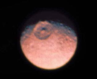 Mimas, moon of Saturn, photographed by NASA's Voyager 1. The crater is about 1/4 of the satellite's diameter and is unique among the explored objects of the solar system.