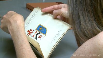 See an illustrated manuscript of 16th-century coats of arms, including commentary on whether Shakespeare is worthy of one