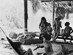 Chocó Indian family in their house on stilts in the jungle of the Mogué River valley, Panama.