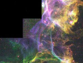 Detail of the Cygnus Loop.This nebula is the product of a supernova explosion; in this section, the blast wave has encountered an area of dense interstellar gas, creating turbulence in the wave and causing it to glow. The picture is a composite of three images taken by the Hubble Space Telescope.