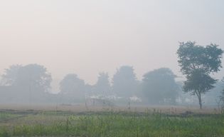 smog over a village in India