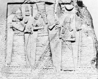 An Assyrian governor standing before the deities Adad (centre) and Ishtar (left), limestone relief from Babylon, 8th century bc; in the Museum of Oriental Antiquities, Istanbul.