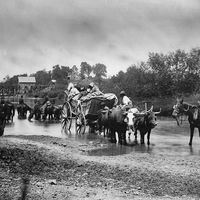 A group of fugitive African Americans crossing the Rappahannock River in Virginia, 1862, during the United States Civil War. Fugitive slaves, escaped slaves, runaway slaves. Photographer Timothy O'Sullivan.