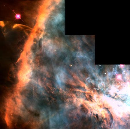 False-colour picture of a stellar formation region in the Orion Nebula (M42).The Orion Nebula is a giant stellar nursery, with over 700 young stars visible to astronomers. Red indicates the presence of nitrogen (mainly on the left), green indicates hydrogen, and blue indicates oxygen. This image was taken by the Hubble Space Telescope.