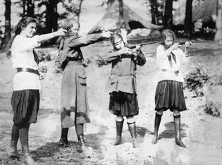 Girl Scouts engaging in target practice, c. 1920.