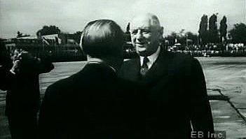 Watch West German Chancellor Adenauer greet French President de Gaulle to forge diplomatic ties after WWII