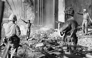 U.S. Marines taking a Japanese prisoner in the Marshall Islands