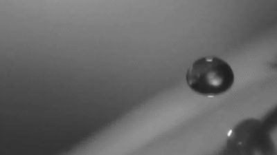 Observe how a superhydrophobic multifunctional glass surface resists fogging, glare, and self cleans