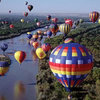 More than 700 balloons fly travel over the Rio Grande in the Albuquerque International Balloon Fiesta, Albuquerque, New Mexico.