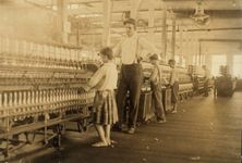 Lewis W. Hine: photograph of an overseer and child workers in the Yazoo City Yarn Mills