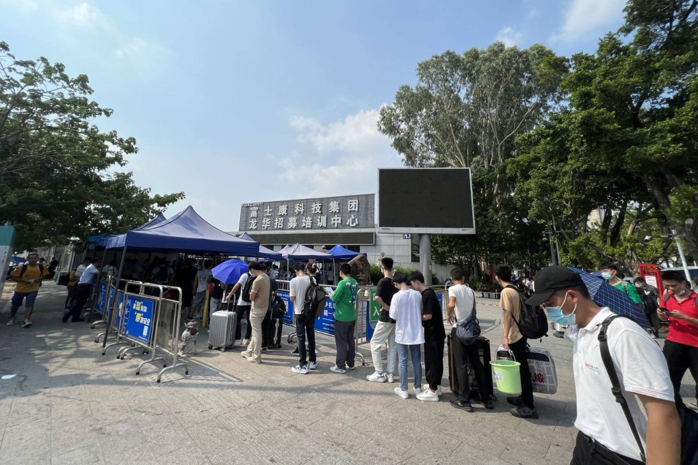 Job seekers line up outside Foxconn Technology Group’s recruitment centre in the Longhua district of Shenzhen, in southern Guangdong province, for interviews and medical check-ups. Photo: Iris Deng