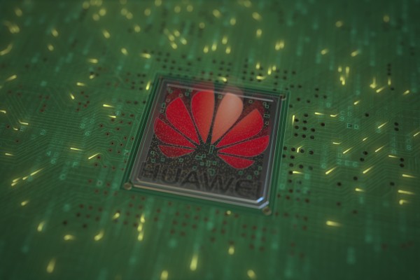 A conceptual illustration of the Huawei logo on a chip mounted to a computer circuit board. Photo:  Shutterstock Images