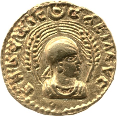 Gold coin, c. 270-300 C.E., gold, Aksumite, © Trustees of the British MuseumObverse showing head and shoulders bust of Endubis facing right, wearing headcloth with rays at forehead and triangular ribbon behind, framed by two wheat-stalks. Disc and crescent at top.