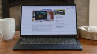 Lenovo Duet 5 Chromebook on a coffee table displaying Laptop Mag