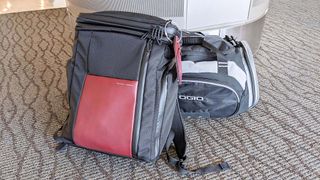 Waterfield Air Porter Travel Backpack on airport floor.