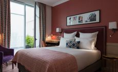  Parisian hotels, Adèle & Jules bedroom with white cushions and long curtain