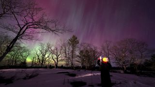 The Northern Lights appear in the sky on March 23, 2023 in Gravenhurst, Ontario, Canada.