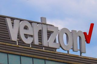 Verizon logo on a building with a blue sky above